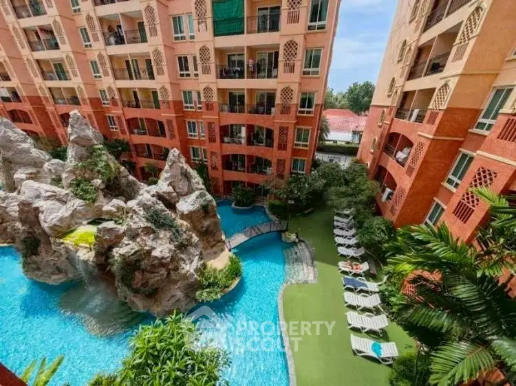 Stunning apartment complex with a unique pool and lush greenery, perfect for relaxation and leisure.