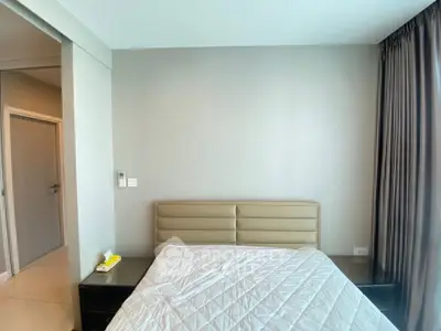 Spacious bedroom with modern decor and natural light
