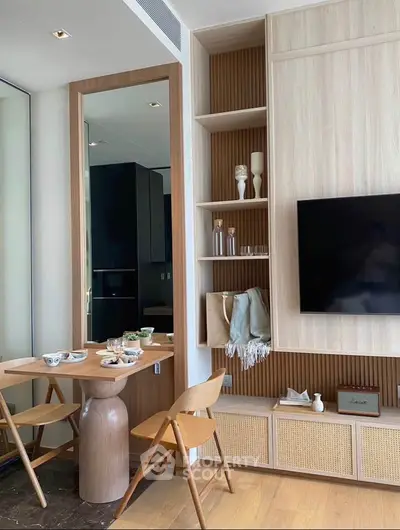 Modern living room with stylish wooden furniture and wall-mounted TV, perfect for cozy gatherings.