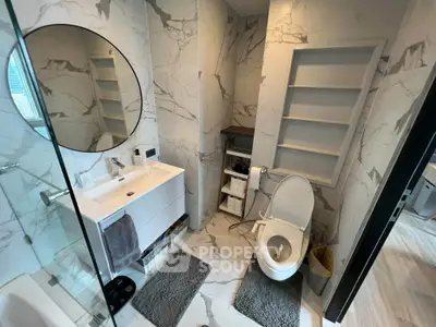 Modern bathroom with marble tiles and sleek fixtures