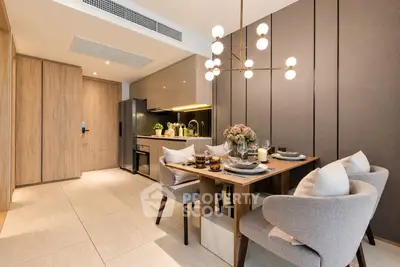 Modern dining area with elegant lighting and cozy seating in a stylish apartment.