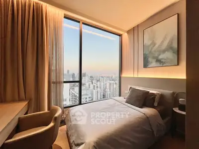 Luxurious bedroom with stunning city view and elegant decor in high-rise apartment.