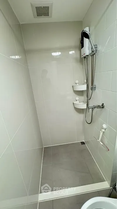 Modern bathroom with sleek shower fixtures and minimalist design