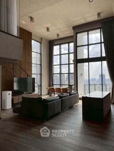 Luxurious high-rise living room with stunning city view and modern decor.