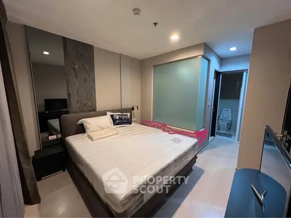 Modern bedroom with ensuite bathroom and stylish decor
