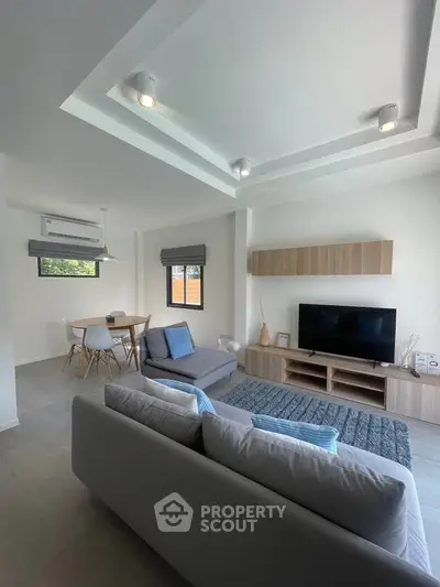 Modern living room with stylish furniture and natural light