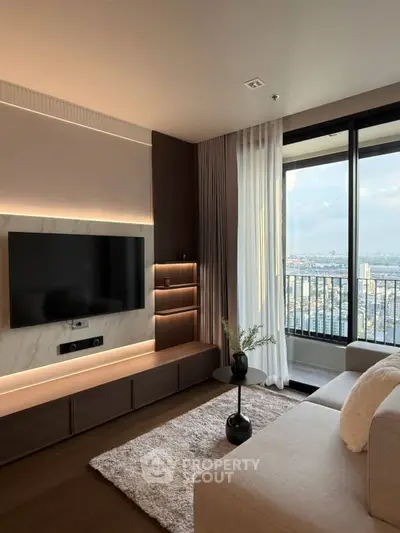 Modern living room with large window and city view, featuring sleek TV setup and elegant decor.