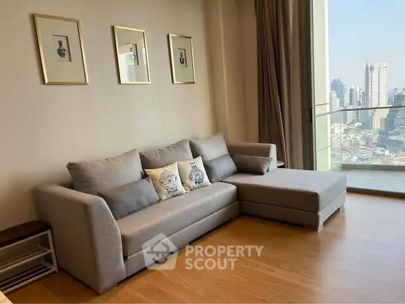 Modern living room with city view and stylish gray sofa