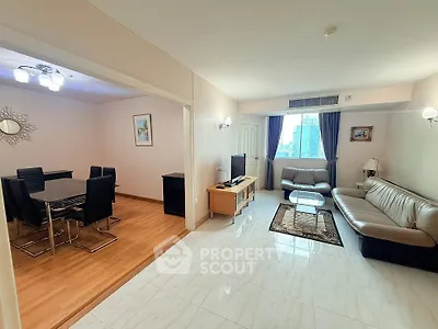 Spacious living room with elegant dining area and city view, perfect for modern urban living.