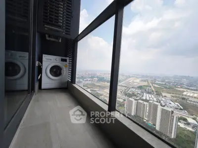High-rise balcony with washing machine and panoramic city view