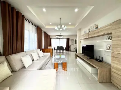 Spacious modern living room with elegant decor and ample natural light