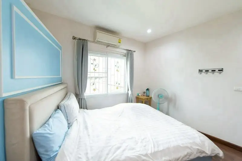 Bright and cozy bedroom with modern decor and natural light