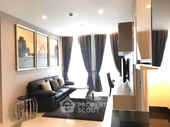 Modern living room with elegant decor and large windows in a stylish apartment.