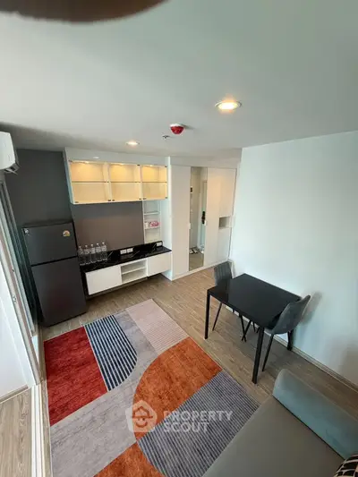 Modern living room with stylish decor, open layout, and contemporary furniture in a bright apartment.