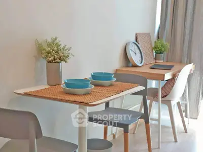 Modern dining area with stylish tableware and natural light