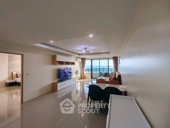 Spacious modern living room with elegant decor and large windows offering stunning views.