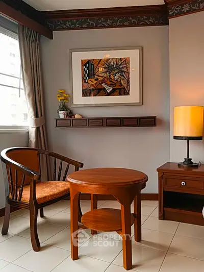 Charming living room corner with elegant wooden furniture and artistic wall decor.
