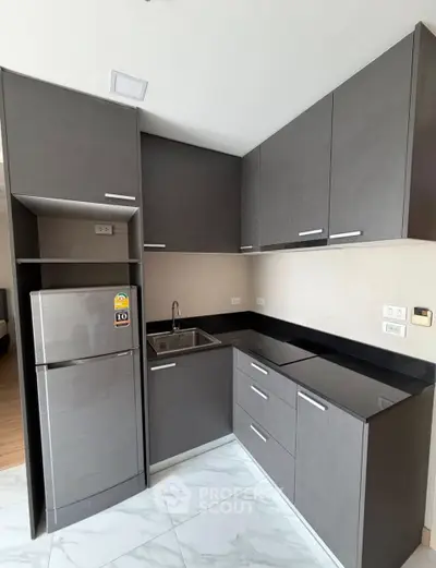 Modern kitchen with sleek cabinetry and stainless steel appliances