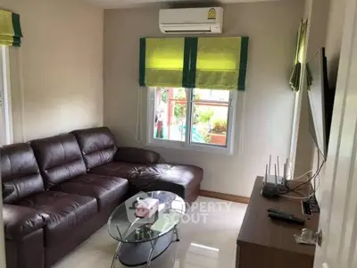 Cozy living room with leather sofa and modern decor