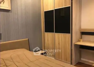 Cozy bedroom with modern wardrobe and stylish decor