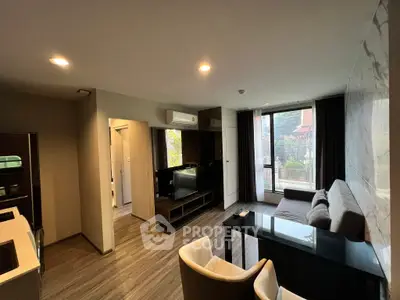 Modern living room with sleek design and large window view