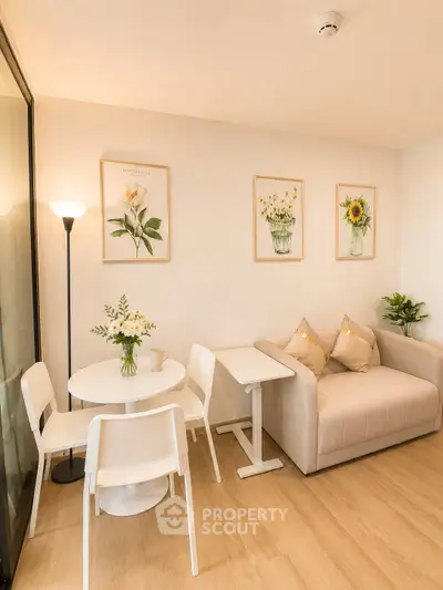 Charming living room with cozy sofa, elegant decor, and dining area, perfect for relaxation and entertaining.
