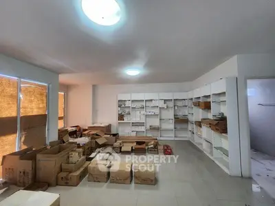 Spacious storage room with boxes and shelves, ideal for organizing and storing items efficiently.