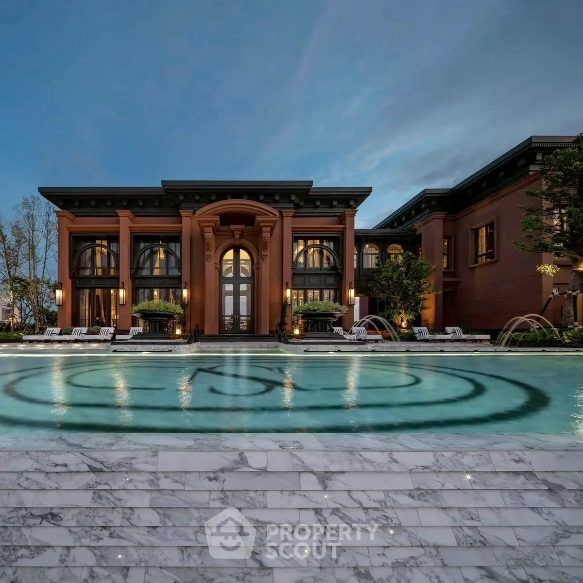 Luxurious mansion with stunning pool and elegant architecture at twilight.