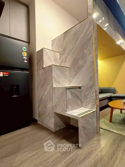 Modern apartment interior with stylish marble staircase and cozy living area
