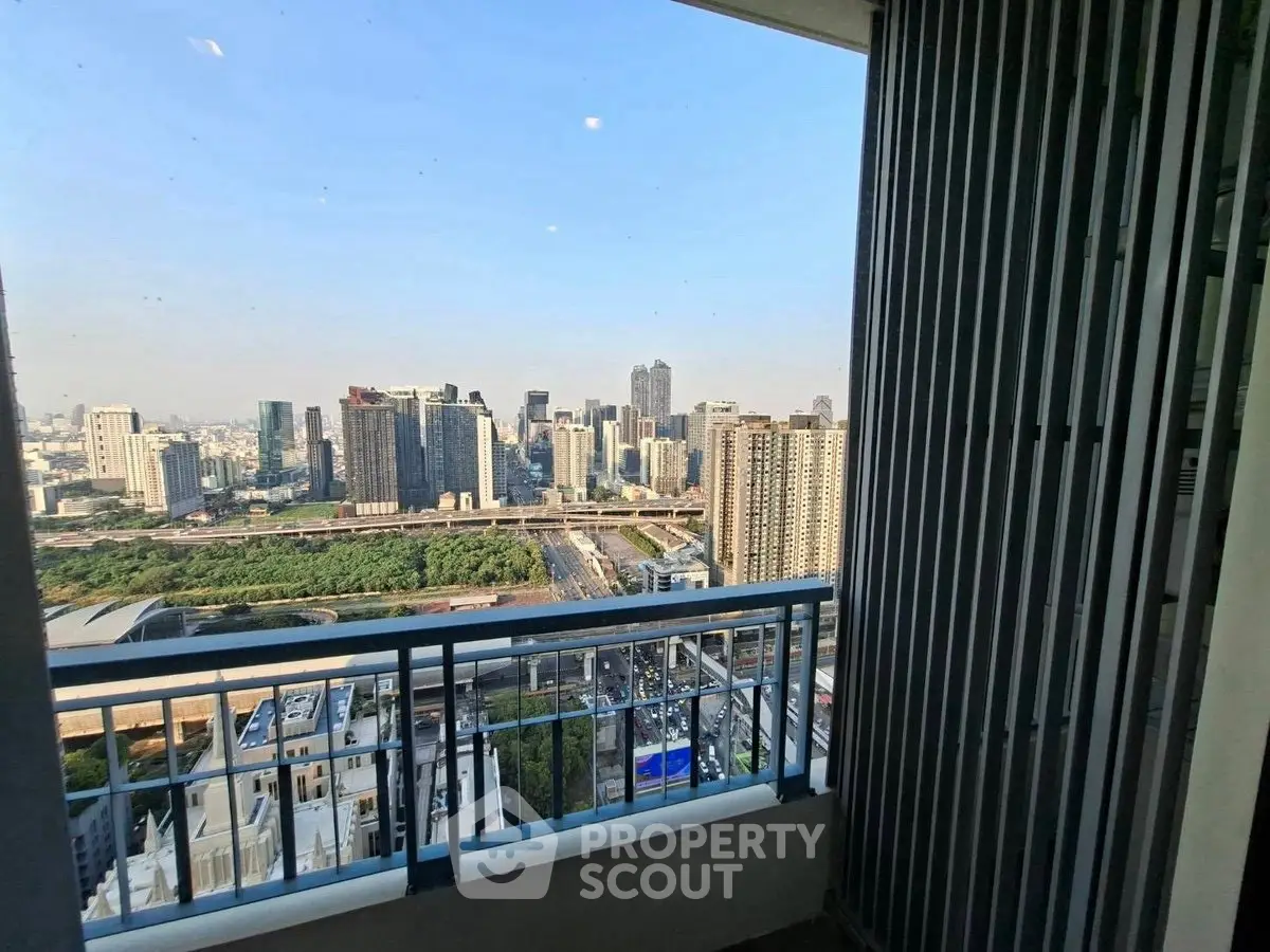 Stunning cityscape view from a high-rise balcony, perfect for urban living.