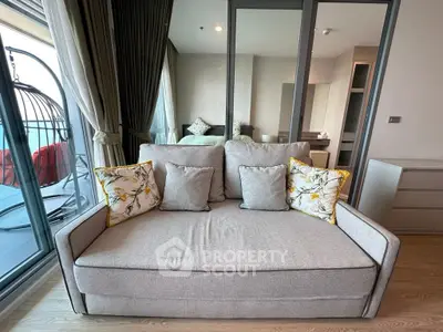 Modern living room with cozy sofa and balcony view in stylish apartment