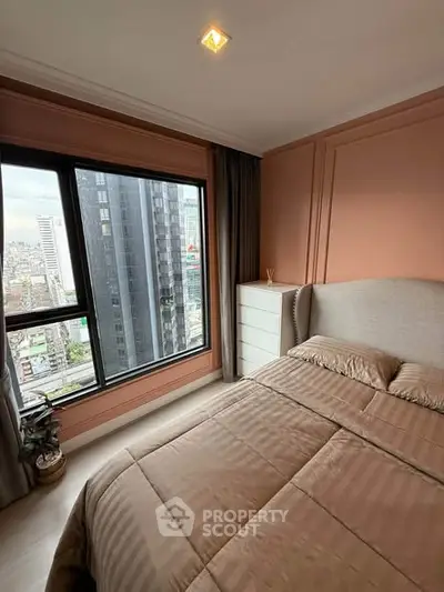 Cozy bedroom with city view in modern high-rise apartment