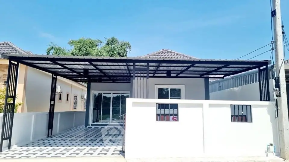 Modern single-story home with covered carport and stylish exterior design.