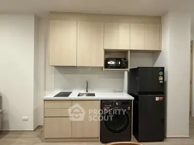 Modern kitchen with integrated appliances and sleek cabinetry