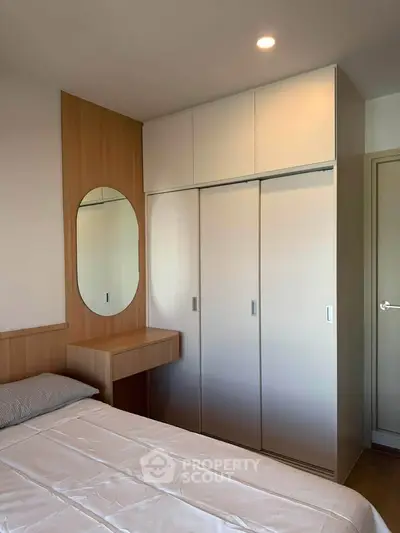Modern bedroom with built-in wardrobe and stylish wooden accents