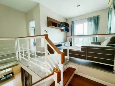 Modern split-level living room with stylish decor and natural light