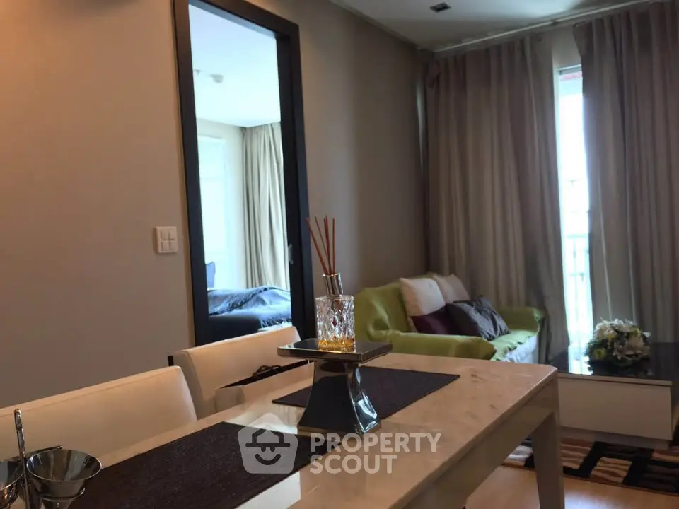 Modern living room with elegant dining area and cozy seating, perfect for relaxation and entertaining.