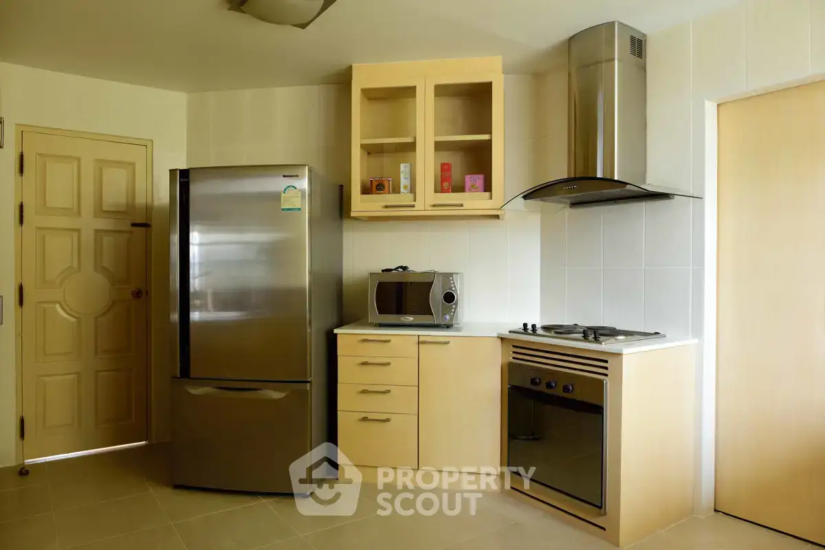 Modern kitchen with stainless steel appliances and sleek cabinetry