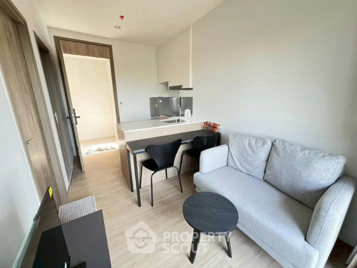 Modern living room with cozy sofa and dining area in stylish apartment