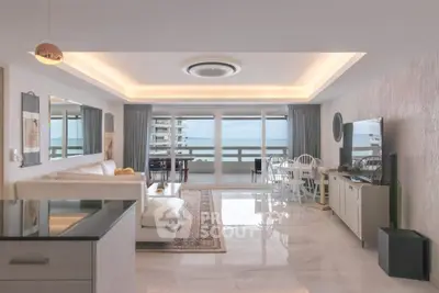 Luxurious living room with ocean view, modern decor, and open layout in a high-end apartment.