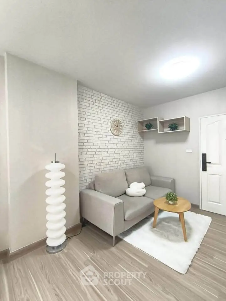 Modern living room with stylish decor and cozy seating area, perfect for relaxation and entertaining.