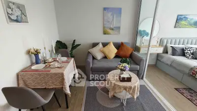 Charming studio apartment with cozy living area and elegant dining setup, perfect for modern urban living.