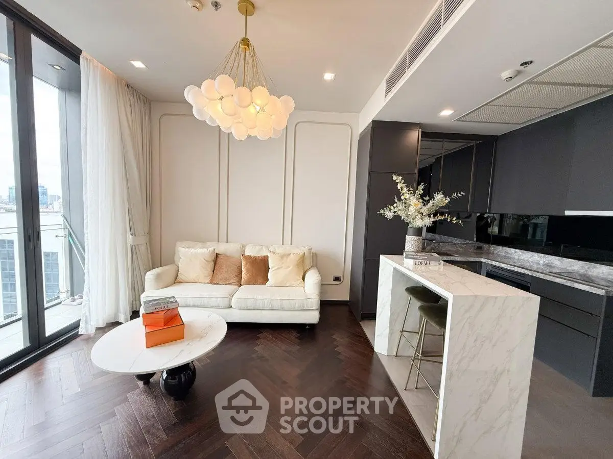 Luxurious modern living room with elegant lighting and open kitchen design
