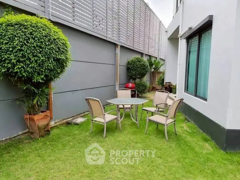 Charming garden with outdoor seating in modern residential property
