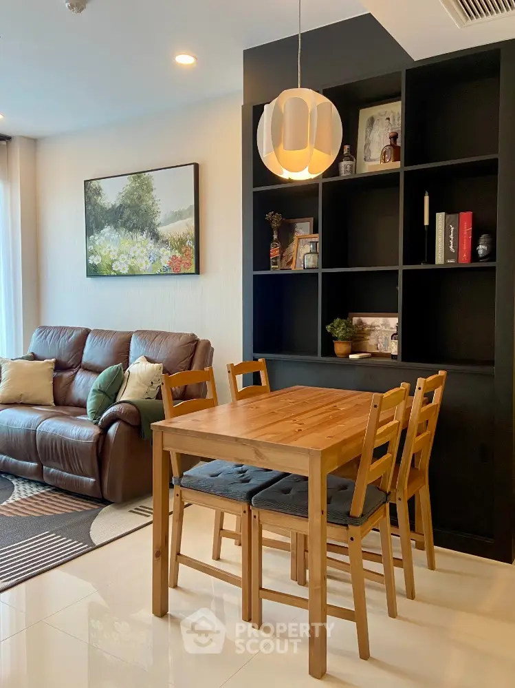 Cozy living room with wooden dining set and modern decor