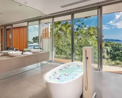 Luxurious bathroom with freestanding tub and stunning nature view
