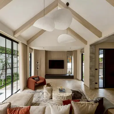 Luxurious living room with vaulted ceiling and modern decor