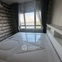 Modern bedroom with large window and stylish decor