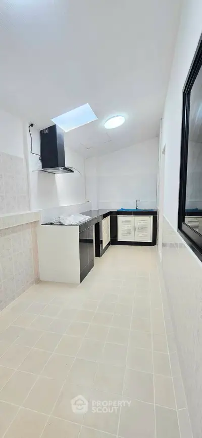 Spacious kitchen with modern design and ample natural light