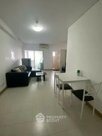 Spacious living room with modern furniture and natural light